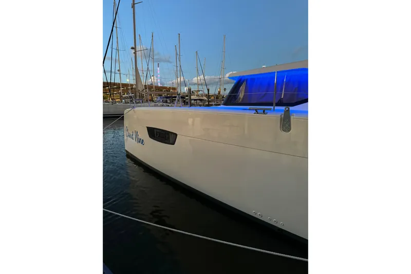 Cloud Nine Yacht Photos Pics 2020 Fountaine Pajot Astrea 42 Catamaran docked at marina during sunset.