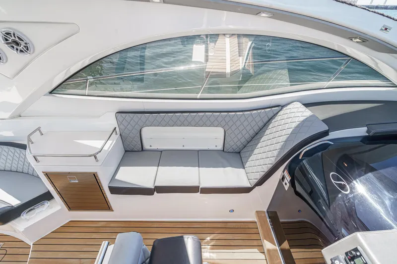 Adamas Yacht Photos Pics Luxurious interior of 2021 Schaefer 400 yacht with elegant seating and wood flooring.