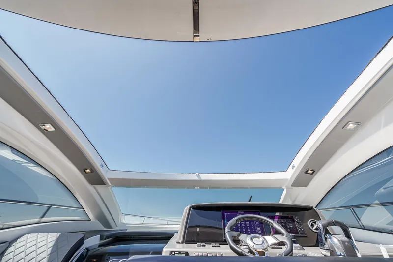 Adamas Yacht Photos Pics Open cockpit view of 2021 Schaefer 400 yacht under clear blue sky.