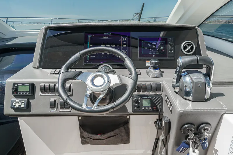 Adamas Yacht Photos Pics Helm of 2021 Schaefer 400 yacht with modern controls and navigation displays.