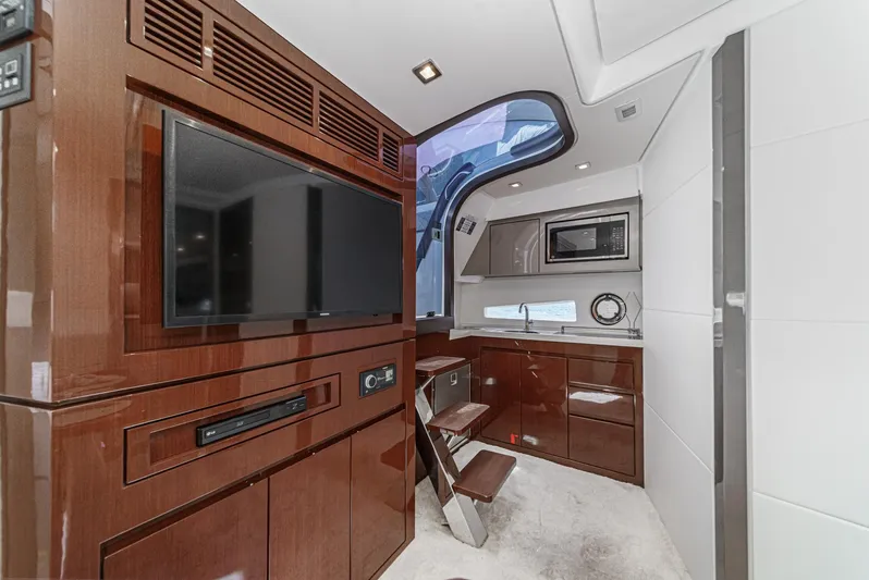 Adamas Yacht Photos Pics Luxurious interior of 2021 Schaefer 400 yacht with modern kitchen and entertainment area.