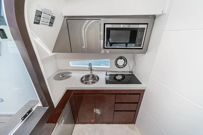 Adamas Yacht Photos Pics Modern kitchen in 2021 Schaefer 400 yacht with microwave, sink, and stove.