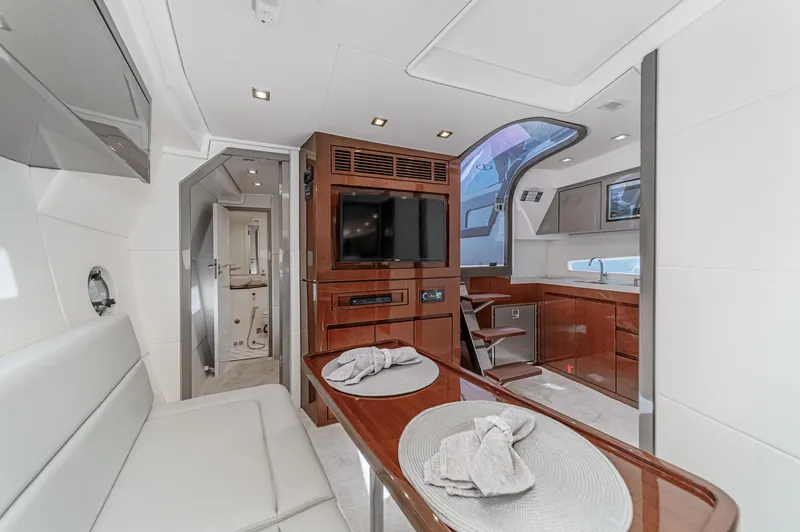 Adamas Yacht Photos Pics Luxurious interior of a 2021 Schaefer 400 yacht with modern furnishings and elegant design.