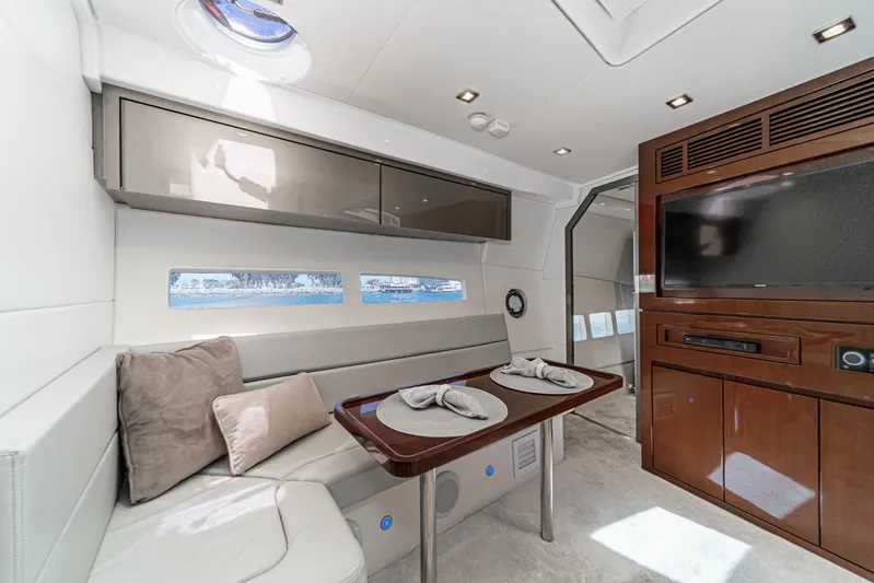 Adamas Yacht Photos Pics Luxurious interior of 2021 Schaefer 400 yacht with dining area and entertainment system.