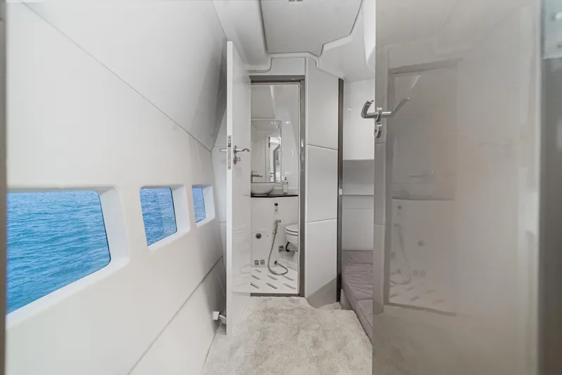 Adamas Yacht Photos Pics Interior of 2021 Schaefer 400 yacht, featuring modern bathroom and ocean view windows.