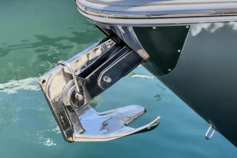 Adamas Yacht Photos Pics Schaefer 400 yacht anchor detail, 2021 model, reflecting on calm water.