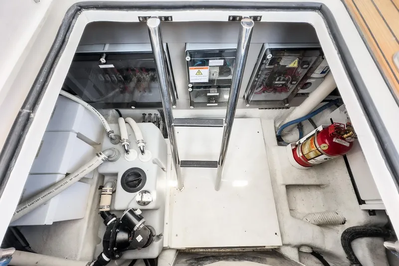 Adamas Yacht Photos Pics Engine compartment of a 2021 Schaefer 400 yacht with safety equipment and control panels.