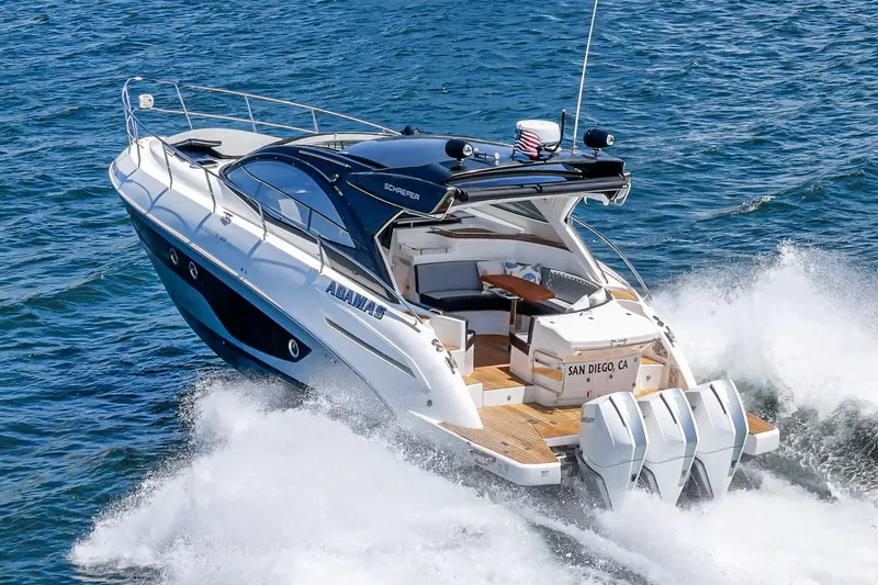 Adamas Yacht Photos Pics 2021 Schaefer 400 yacht cruising on ocean waves, rear view.