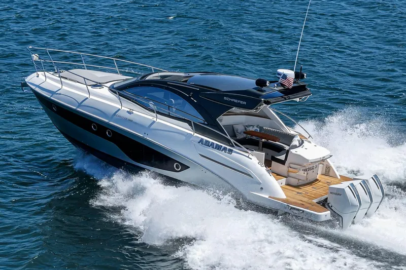 Adamas Yacht Photos Pics Schaefer 400 yacht cruising on open water, 2021 model, sleek design, powerful engines.