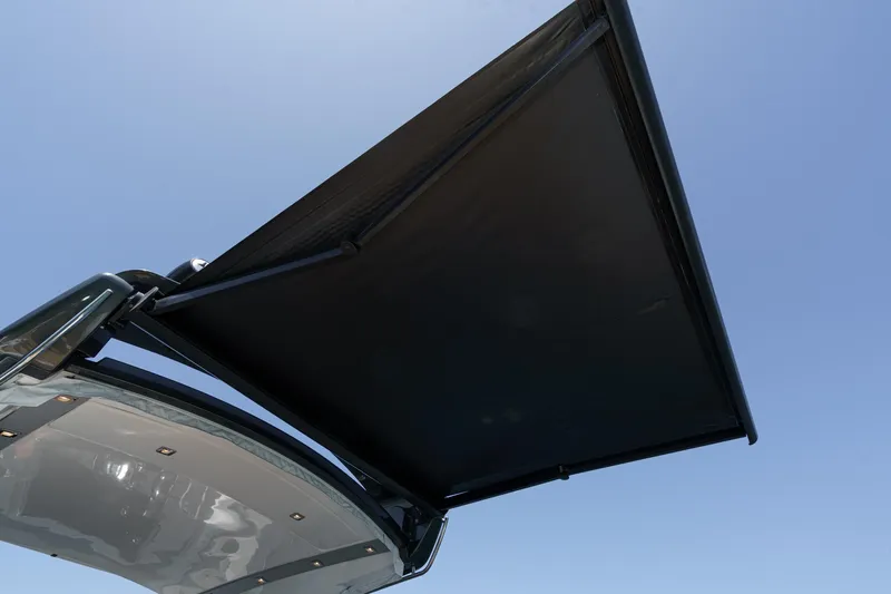 Adamas Yacht Photos Pics Schaefer 400 yacht's retractable sunshade against clear blue sky, 2021 model.