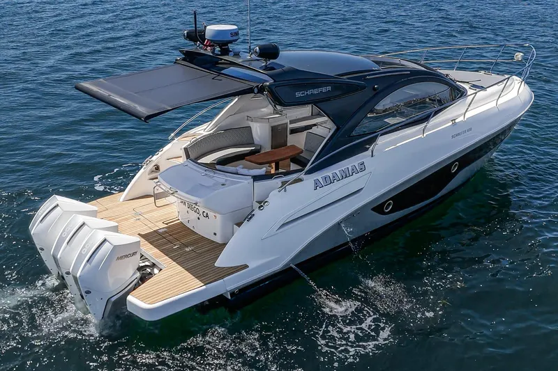 Adamas Yacht Photos Pics Schaefer 400 yacht cruising on open water, 2021 model, with twin outboard engines.