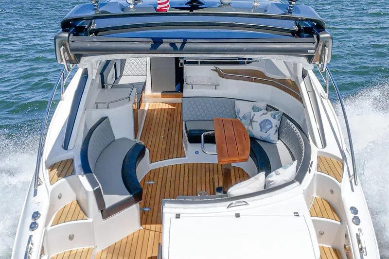 Adamas Yacht Photos Pics 2021 Schaefer 400 yacht with elegant seating and wooden deck on open water.