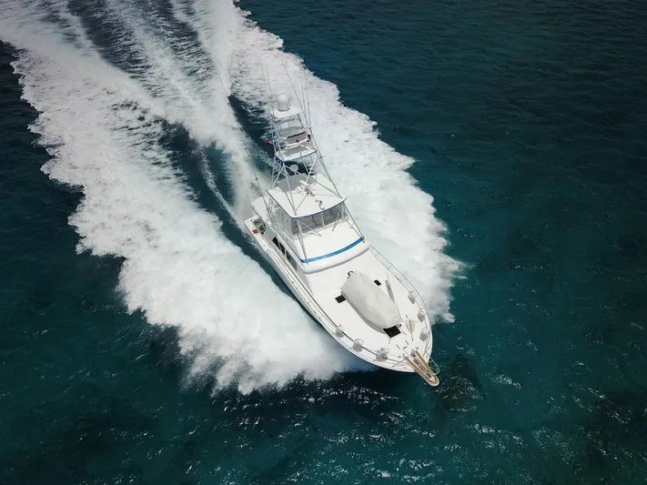 Maple Leaf Yacht Photos Pics 1981 Bertram Convertible yacht cruising on open water.