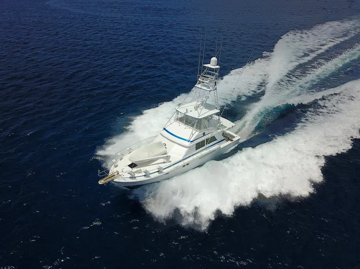 Maple Leaf Yacht Photos Pics 1981 Bertram Convertible yacht cruising on open water.