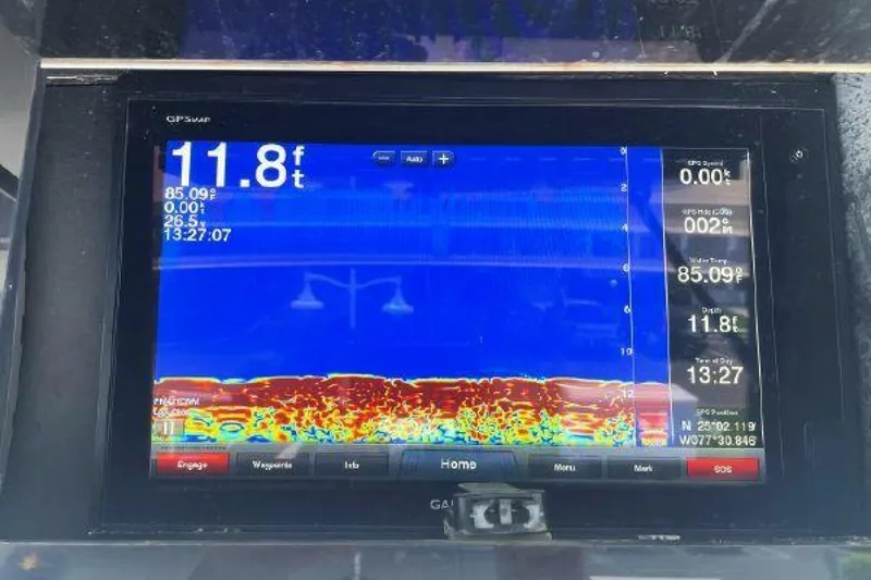 Maple Leaf Yacht Photos Pics Fishfinder display on a 1981 Bertram Convertible boat showing depth and underwater details.