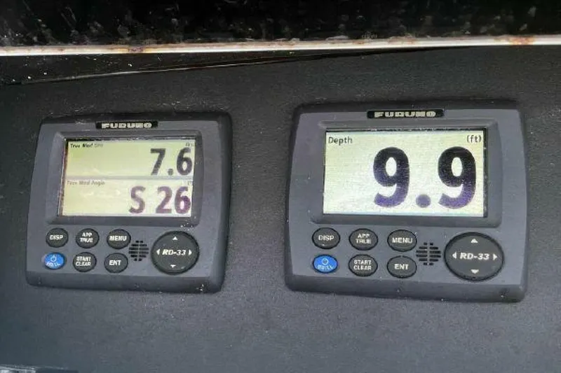 Maple Leaf Yacht Photos Pics Furuno navigation instruments on a 1981 Bertram Convertible boat displaying wind speed and depth.