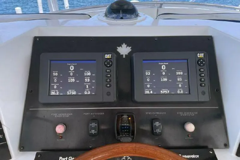 Maple Leaf Yacht Photos Pics 1981 Bertram Convertible boat dashboard with dual CAT engine displays.