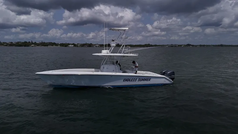 Yacht Photos Pics 2001 Venture 34 boat named "Endless Summer" on calm waters under cloudy skies.