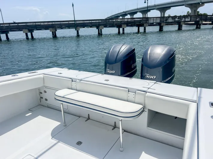  Yacht Photos Pics Venture 34 boat with twin 300 horsepower engines, docked near a bridge, 2001 model.