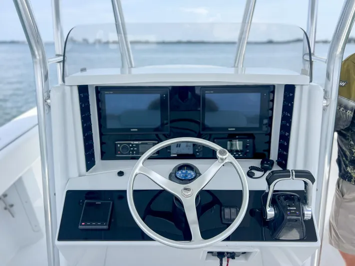  Yacht Photos Pics Helm of 2001 Venture 34 boat with dual screens and steering wheel.