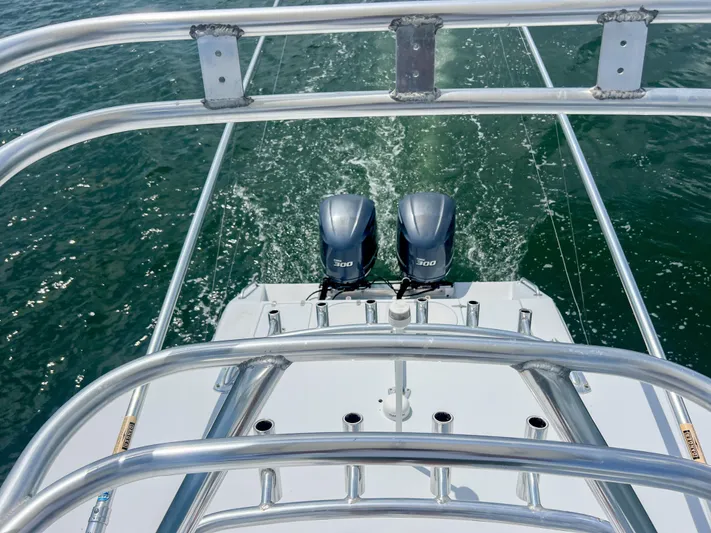  Yacht Photos Pics Venture 34 boat with dual engines cruising on water, 2001 model.