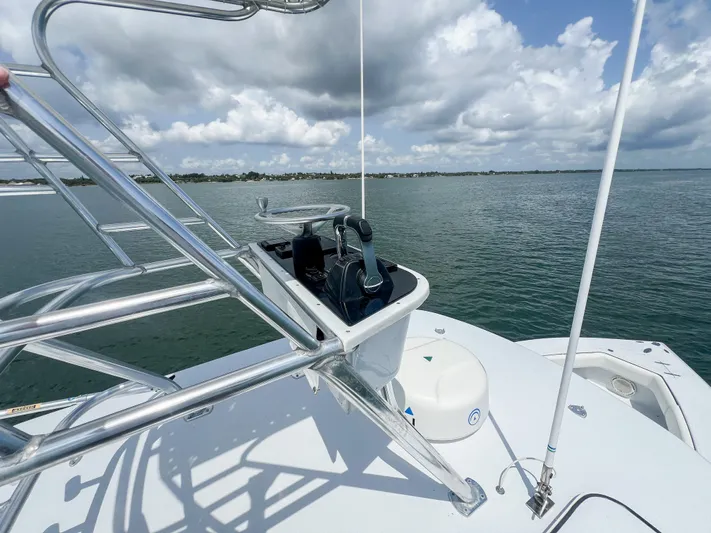  Yacht Photos Pics Venture 34 boat helm with ocean view, 2001 model, under cloudy sky.