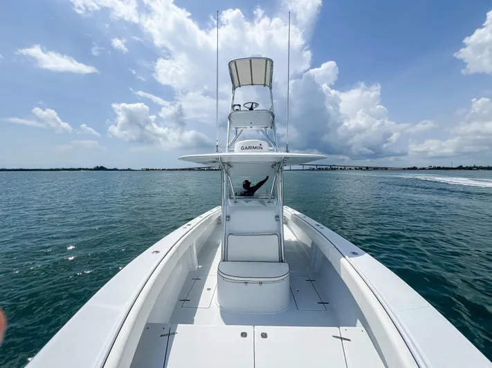  Yacht Photos Pics 2001 Venture 34 boat on open water under a clear blue sky.