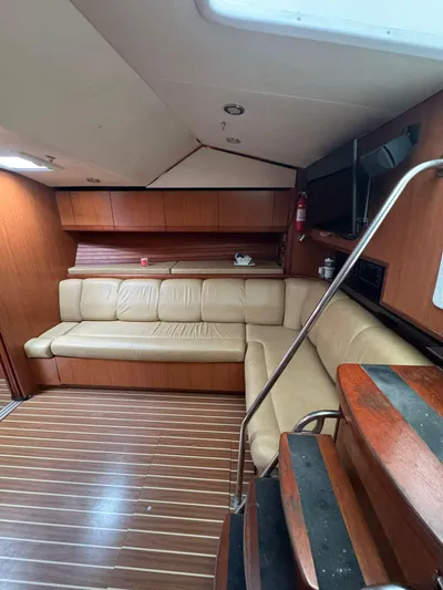 Aubreezy Yacht Photos Pics 2007 Luhrs 41 Express yacht interior with leather seating and wooden flooring.