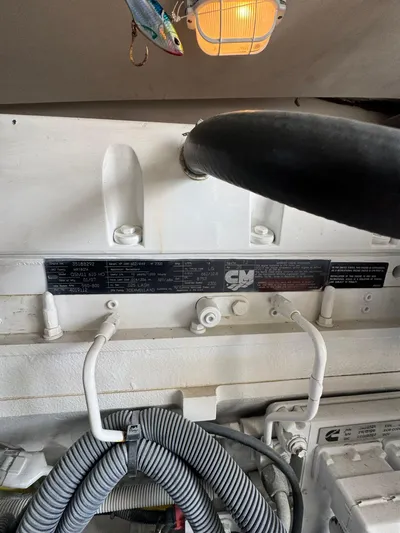 Aubreezy Yacht Photos Pics Engine compartment of a 2007 Luhrs 41 Express boat, featuring mechanical components and wiring.