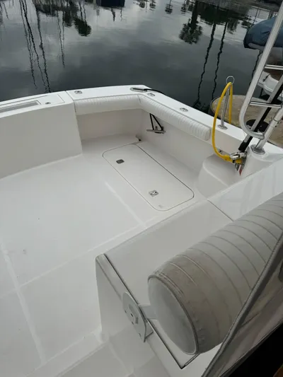 Aubreezy Yacht Photos Pics 2007 Luhrs 41 Express boat deck with seating and storage, docked at marina.