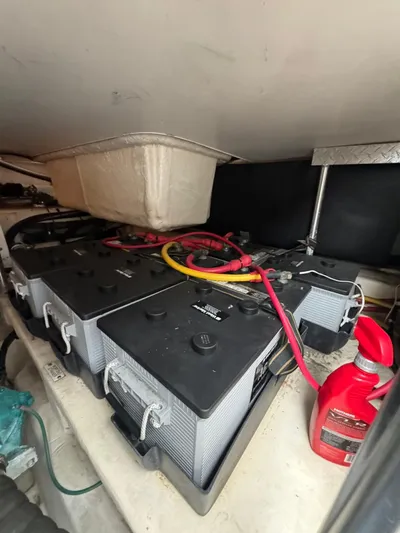 Aubreezy Yacht Photos Pics Battery compartment of a 2007 Luhrs 41 Express boat with cables and a red container.