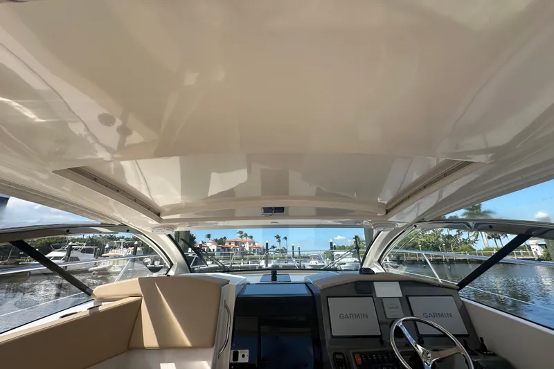  Yacht Photos Pics Interior view of 2015 Pursuit SC 365i Sport Coupe yacht cockpit with Garmin navigation.