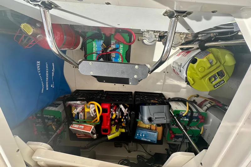  Yacht Photos Pics 2015 Pursuit SC 365i Sport Coupe engine compartment with tools and equipment storage.