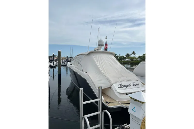  Yacht Photos Pics 2015 Pursuit SC 365i Sport Coupe docked with cover, marina background.
