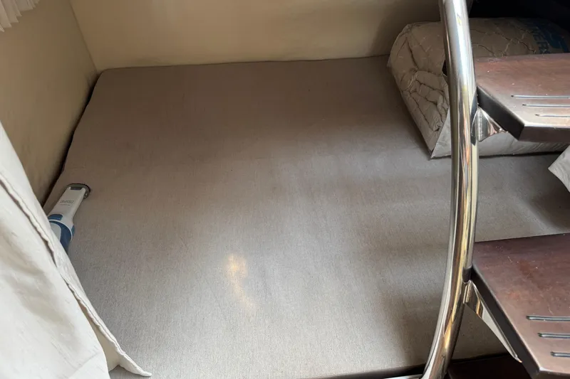 Don't Ask Yacht Photos Pics Interior cabin of 2018 Regal 28 Express boat with bedding and stairs.