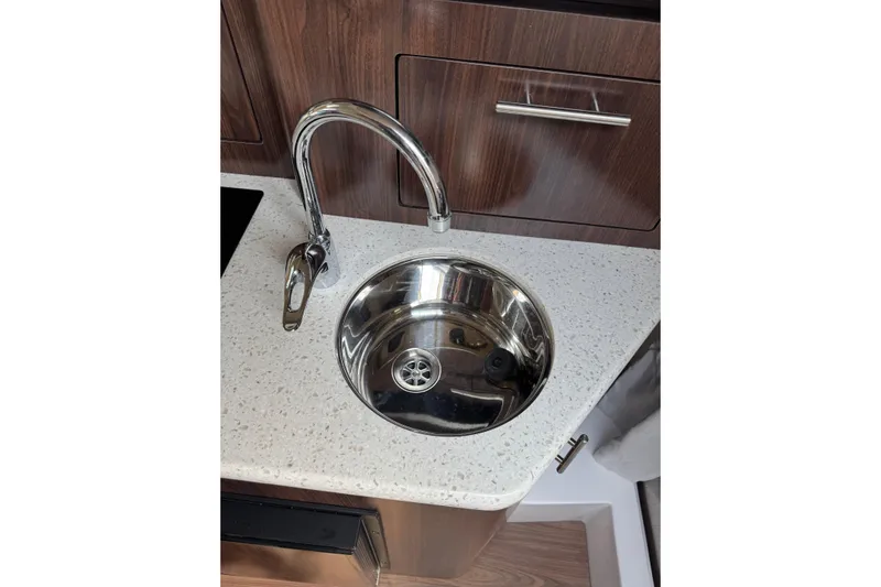 Don't Ask Yacht Photos Pics Stainless steel sink and faucet in 2018 Regal 28 Express boat interior.