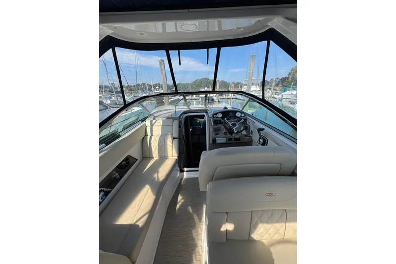 Don't Ask Yacht Photos Pics Interior view of 2018 Regal 28 Express boat with beige seating and dashboard.