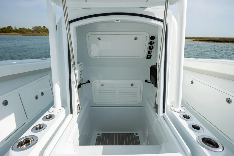  Yacht Photos Pics 2024 Yellowfin 34 Offshore boat interior with storage compartments and rod holders.