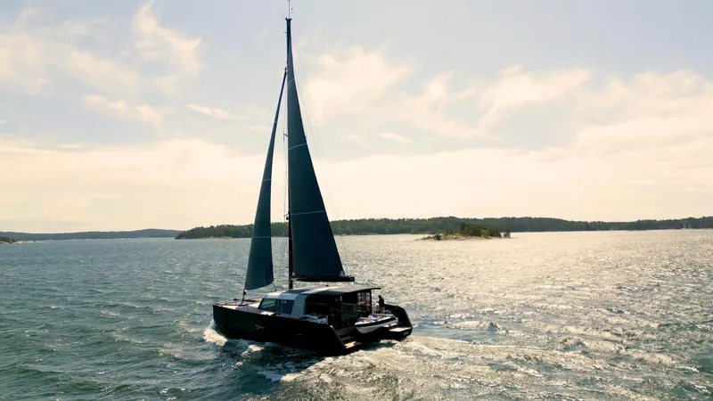  Yacht Photos Pics Sailing catamaran Vaan R5, 2025 model, cruising on a sunny day.