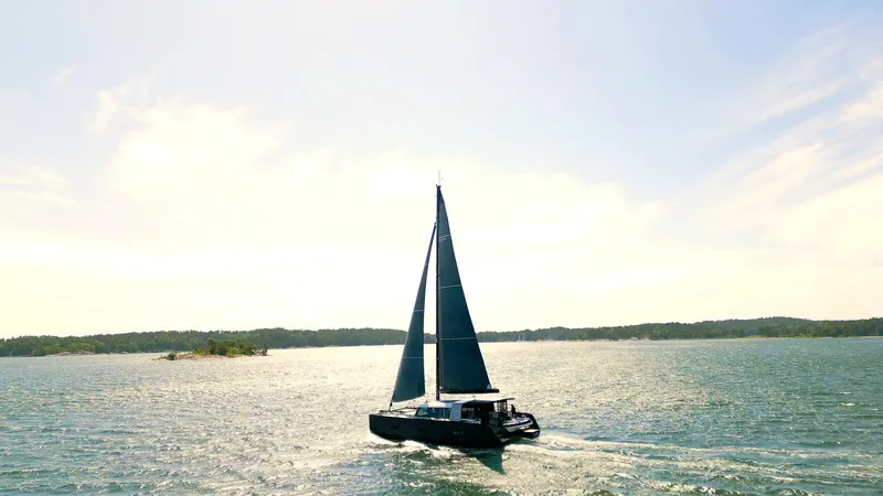  Yacht Photos Pics Sailing yacht Vaan R5 2025 gliding on a sunny, serene sea.
