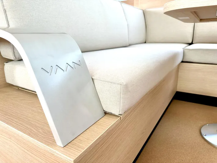  Yacht Photos Pics Modern Vaan R5 2025 interior with sleek beige seating and wooden accents.