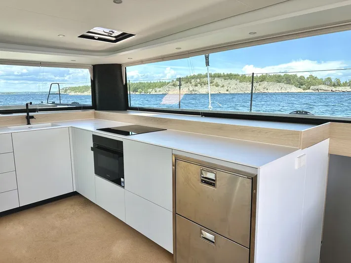  Yacht Photos Pics Modern kitchen interior on 2025 Vaan R5 yacht with ocean view.