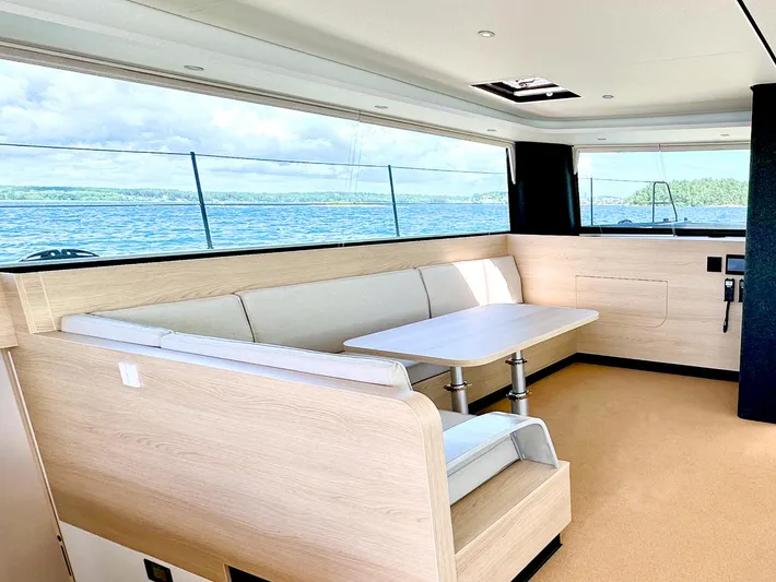  Yacht Photos Pics Luxurious interior of 2025 Vaan R5 yacht with ocean view and modern seating area.