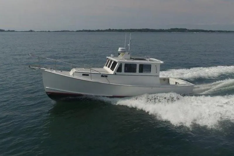 Grey Goose Yacht Photos Pics 2002 West Bay 31 boat cruising on open water.