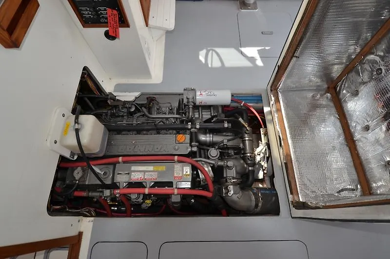 Grey Goose Yacht Photos Pics Engine compartment of a 2002 West Bay 31 boat, showcasing detailed mechanical components.