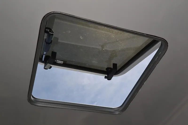 Grey Goose Yacht Photos Pics Open hatch on 2002 West Bay 31 boat, showing sky view.