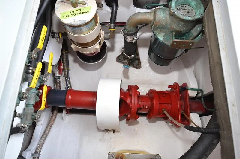 Grey Goose Yacht Photos Pics Engine compartment of a 2002 West Bay 31 boat, showing mechanical components and piping.