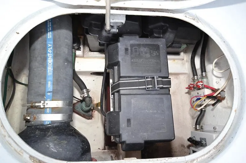 Grey Goose Yacht Photos Pics Engine compartment of a 2002 West Bay 31 boat, featuring battery and wiring.