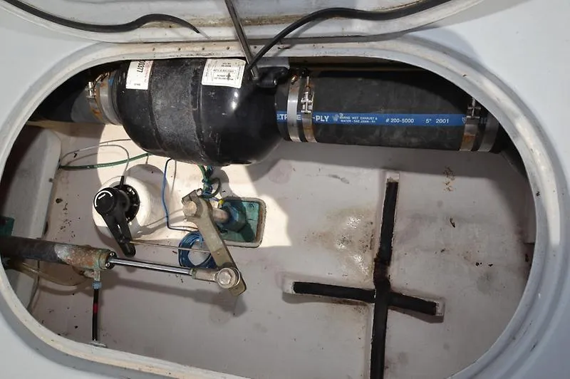 Grey Goose Yacht Photos Pics Engine compartment of a 2002 West Bay 31 boat, showing mechanical components and hoses.