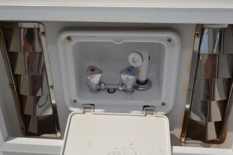 Grey Goose Yacht Photos Pics Outdoor shower controls on a 2002 West Bay 31 boat, featuring chrome accents.